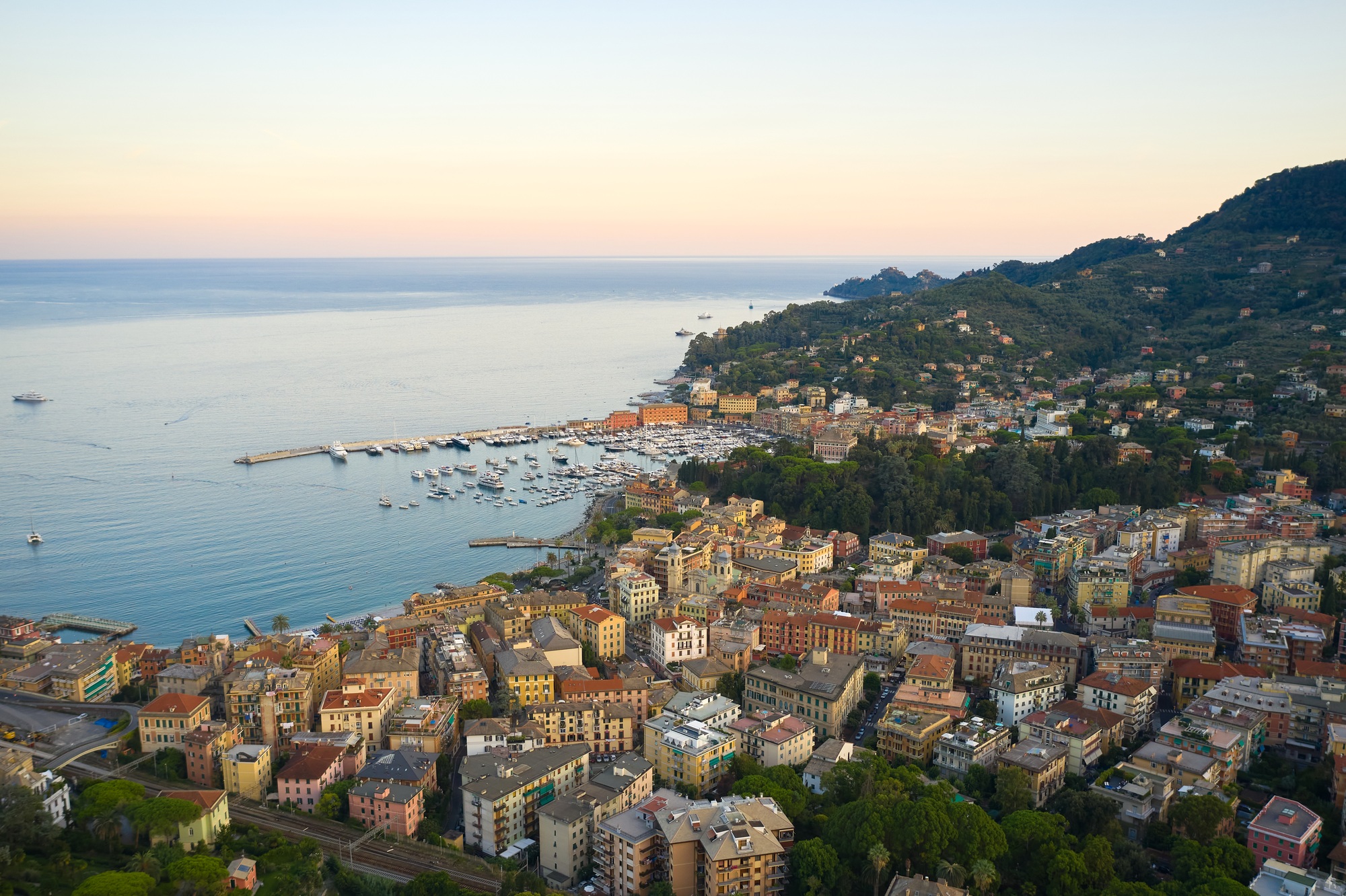 Sunset in italian riviera. Top view of a small town with traditional italian houses close to the